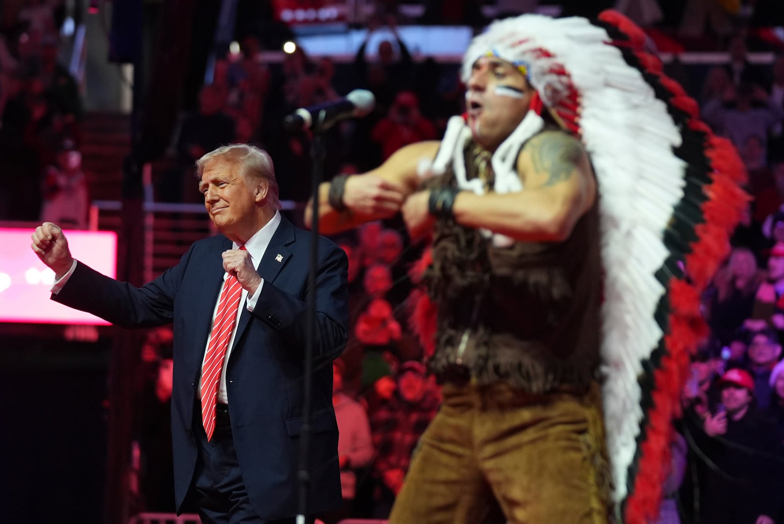 President-elect Donald Trump dances with The Village People at a rally ahead of the 60th Presidential Inauguration, Sunday, Jan. 19, 2025, in Washington. (AP Photo/Evan Vucci)