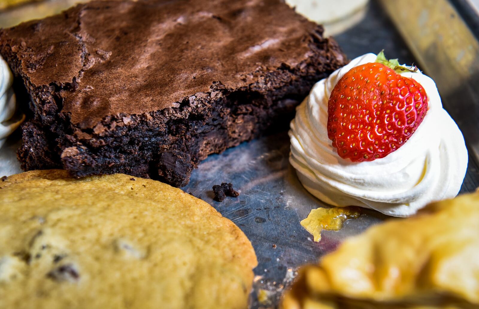 A sampling of Skally’s house-made deserts featuring a gluten free brownie, chocolate chip cookie and baklava. 