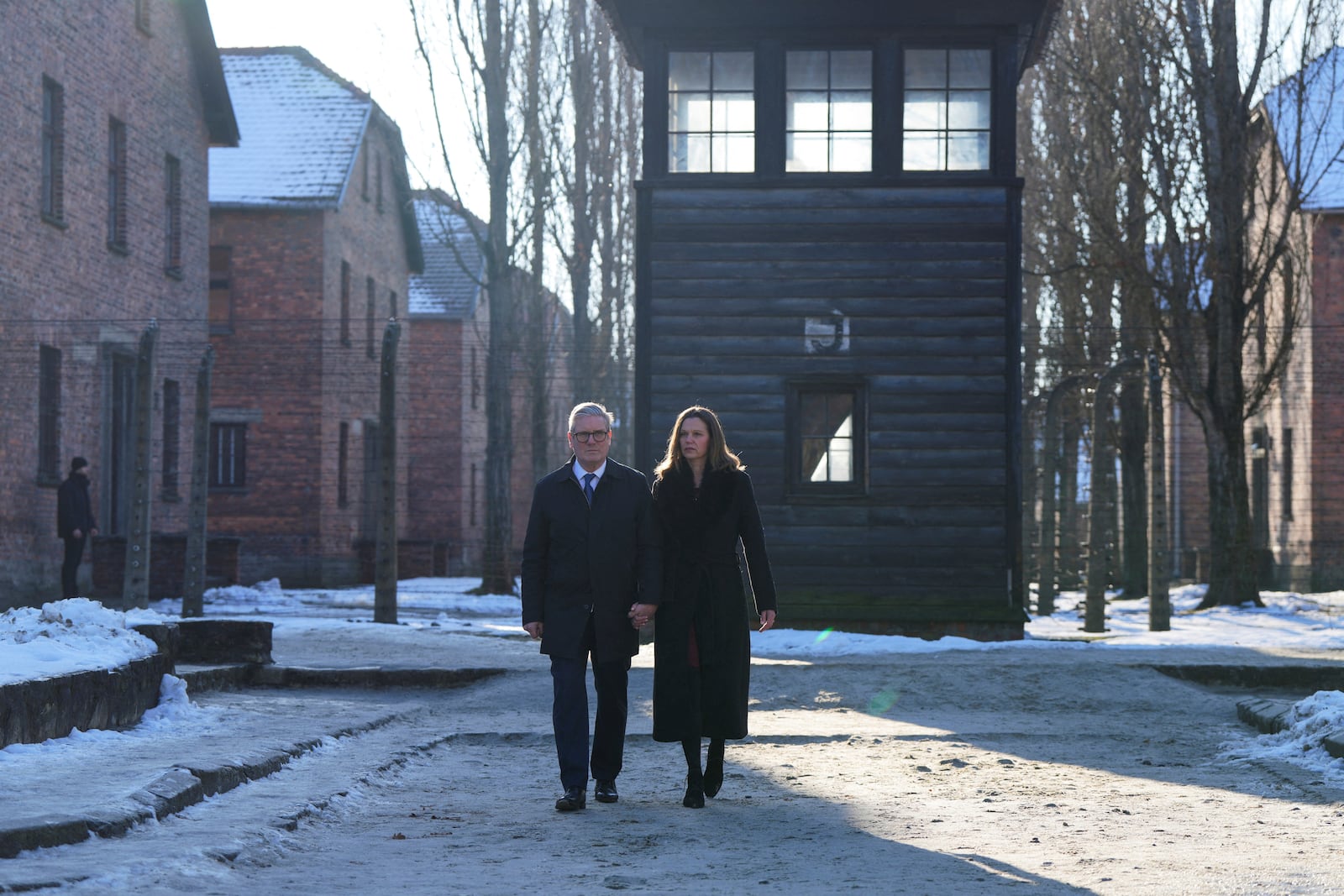 Britain's Prime Minister Keir Starmer and his wife Victoria Starmer visit the Memorial And Museum Auschwitz-Birkenau, a former Nazi German concentration and extermination camp, in Oswiecim, Poland, Friday Jan. 17, 2025. (Aleksandra Szmigiel/Pool via AP)