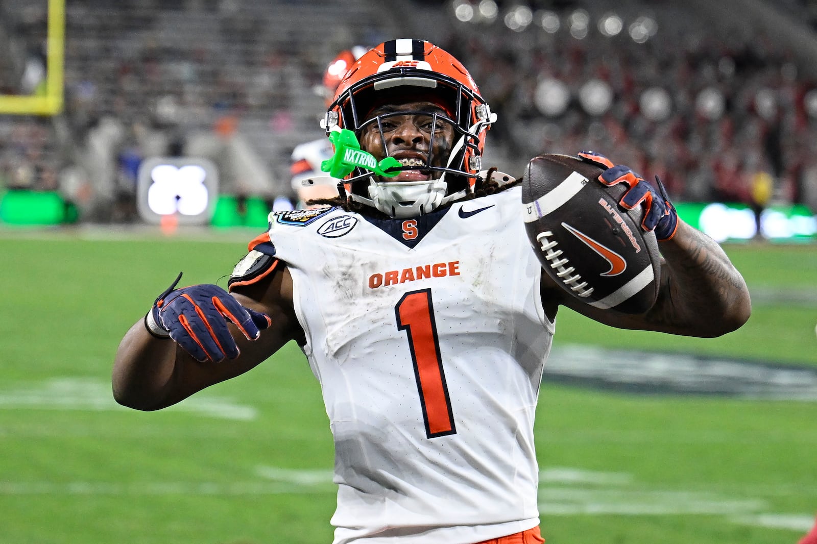 Syracuse running back LeQuint Allen (1) celebrates after scoring on a two-point conversion during the first half of the Holiday Bowl NCAA college football game against Washington State Friday, Dec. 27, 2024, in San Diego. (AP Photo/Denis Poroy)