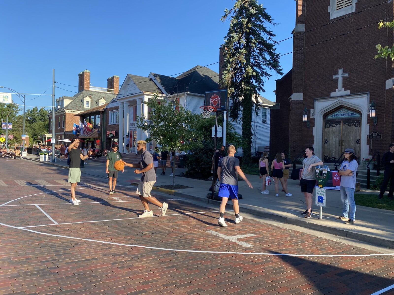 Local businesses and organizations on Oxford participate in the Red Brick Friday events. Last year, St. Mary’s Catholic Church set up a basketball hoop on the street in front of its building. CONTRIBUTED/CITY OF OXFORD