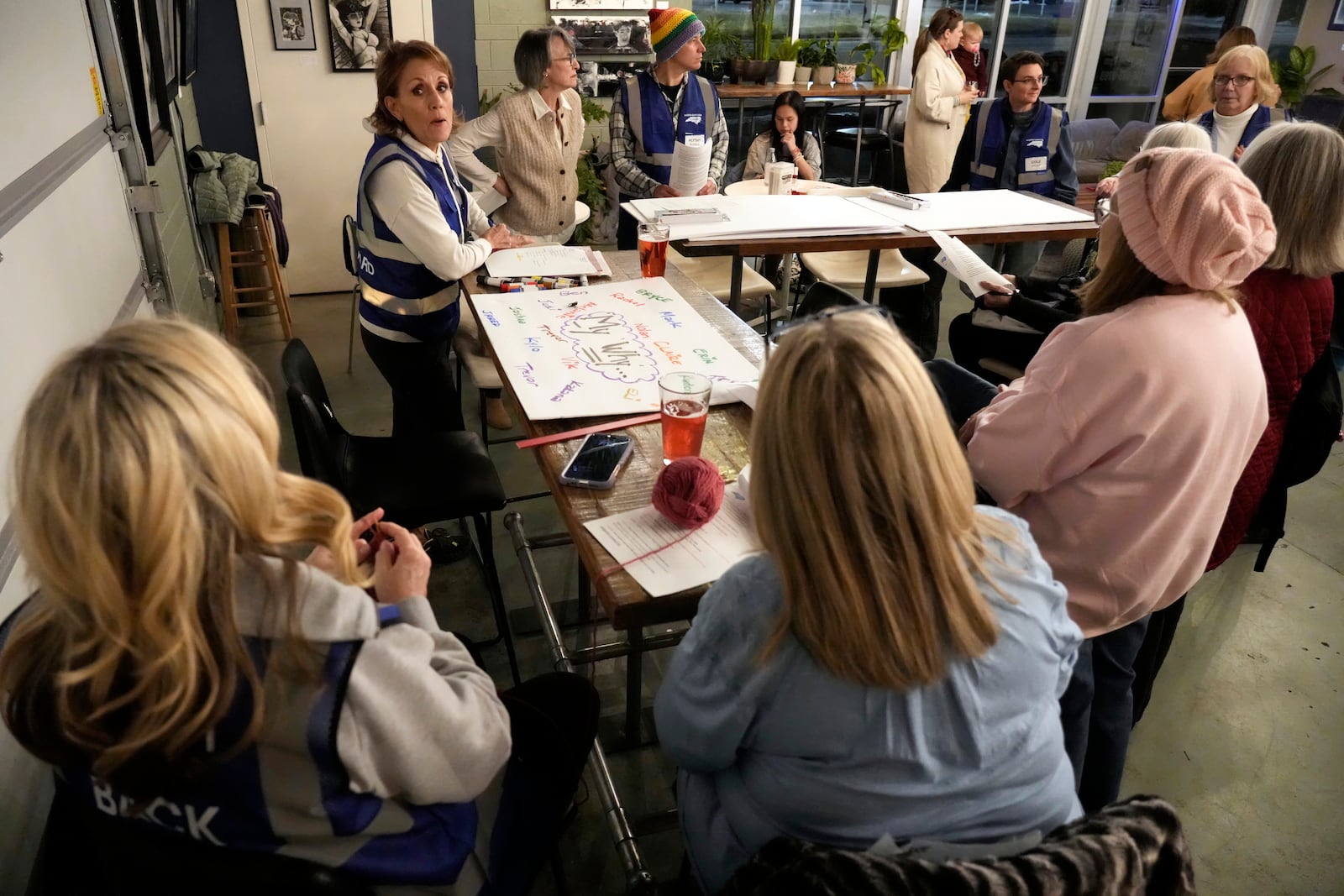 Elisabeth Bramble speaks to members of NC Forward during a meeting in High Point, N.C., Tuesday, Jan. 14, 2025. The group is traveling to Washington to take part in the People's March on Jan. 18 ahead of the inauguration. (AP Photo/Chuck Burton)