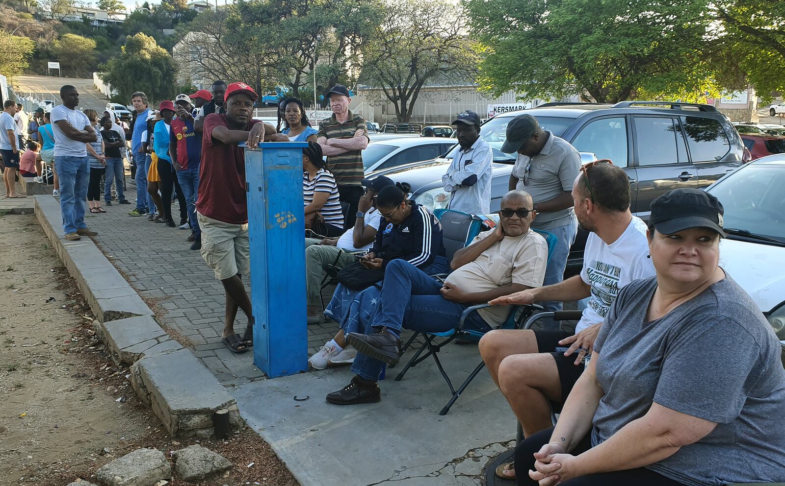 Namibians queue to cast their votes in a presidential election in Windhoek, Namibia Wednesday, Nov. 27, 2024. (AP Photo/Dirk Heinrich)