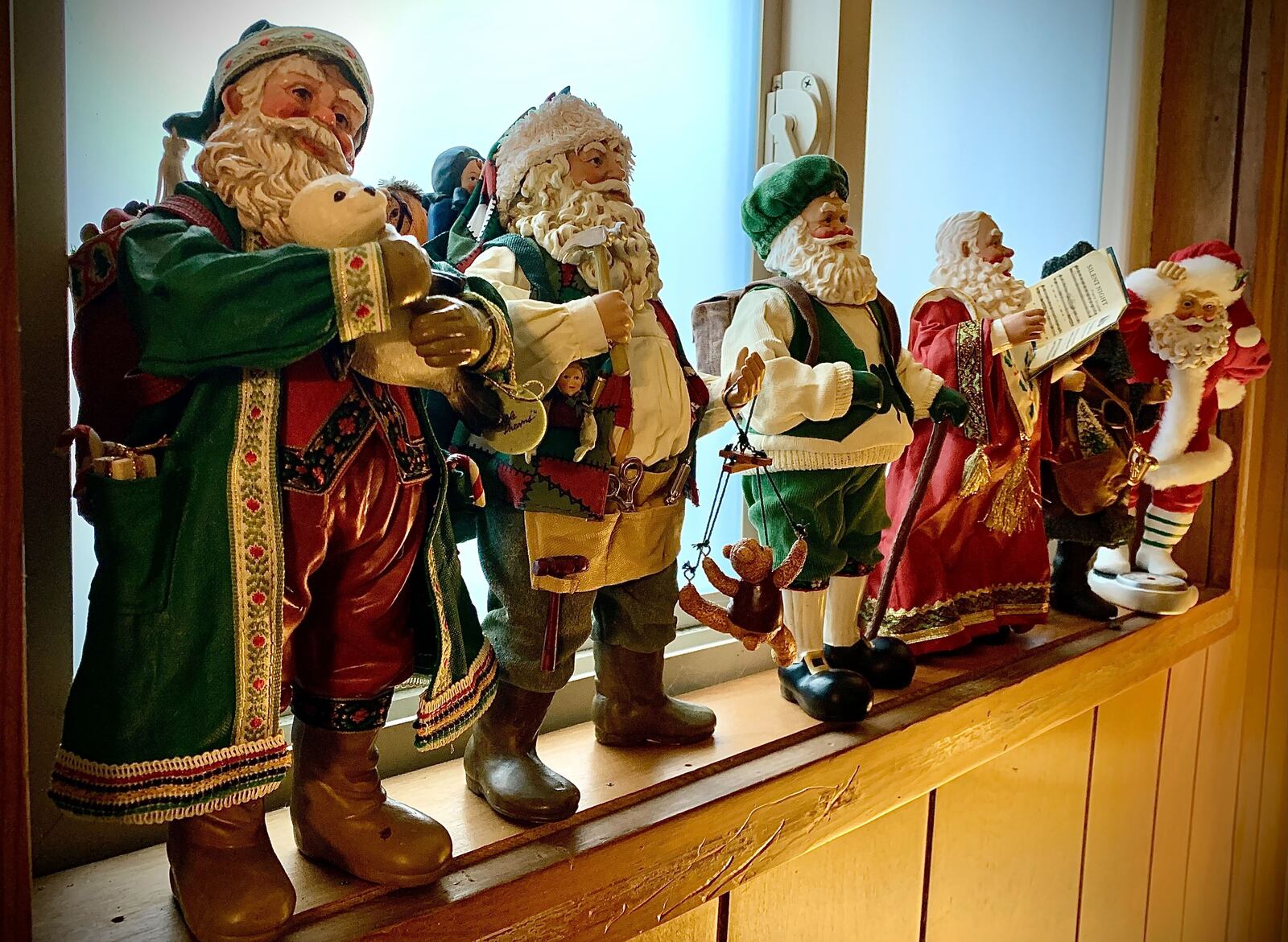 Michael Roediger, director of the Dayton Art Institute, collects Santa figures and has a collection of 500 of them. MARSHALL GORBY\STAFF