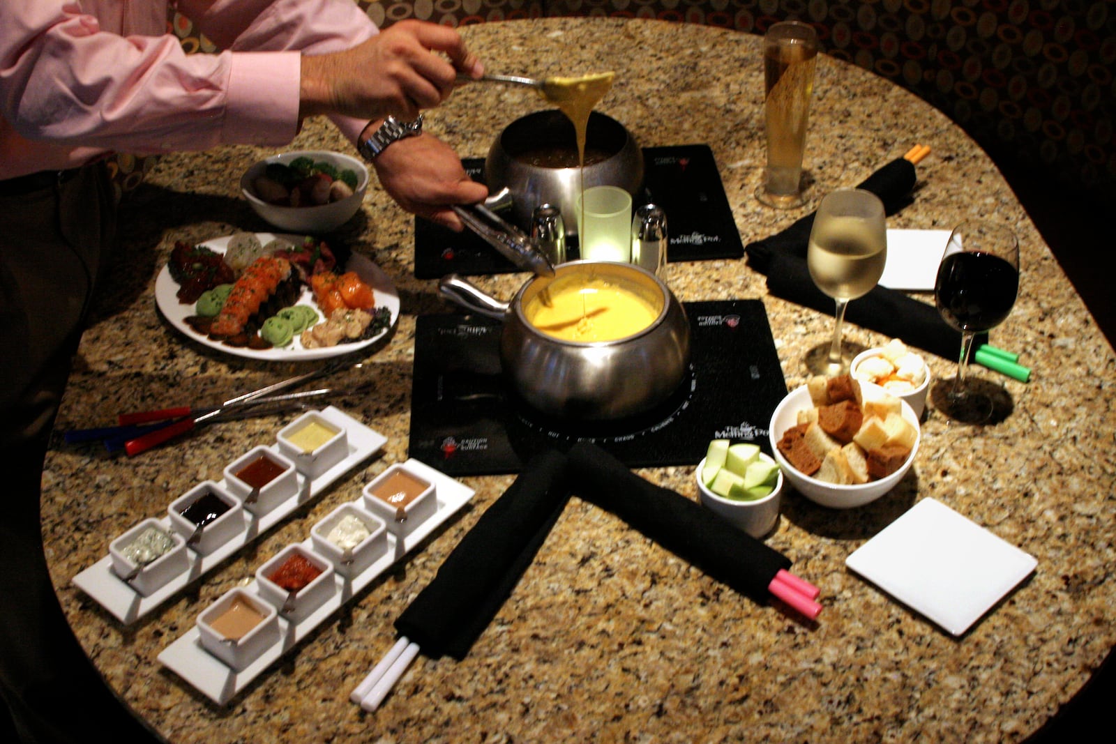 The menu item Fondue Fusion at the Melting Pot in Centerville includes lobster tail, filet mignon, cedar plank salmon, BBQ pork tenderloin, shrimp, honey dijon chicken and spinach/artichoke ravioli with dipping sauce and fondue.