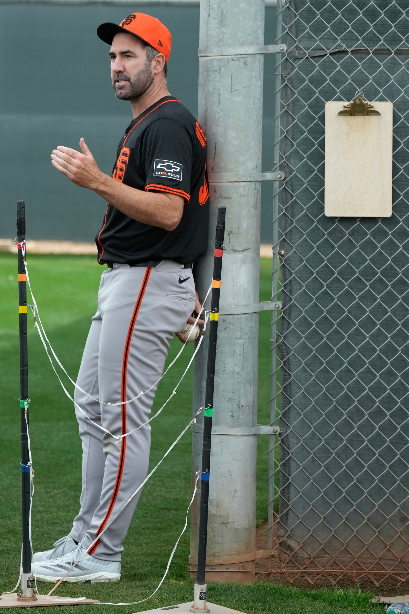 San Francisco Giants pitcher Justin Verlander talks with other Giants at the team's spring training baseball facility Thursday, Feb. 13, 2025, in Scottsdale, Ariz. (AP Photo/Ross D. Franklin)