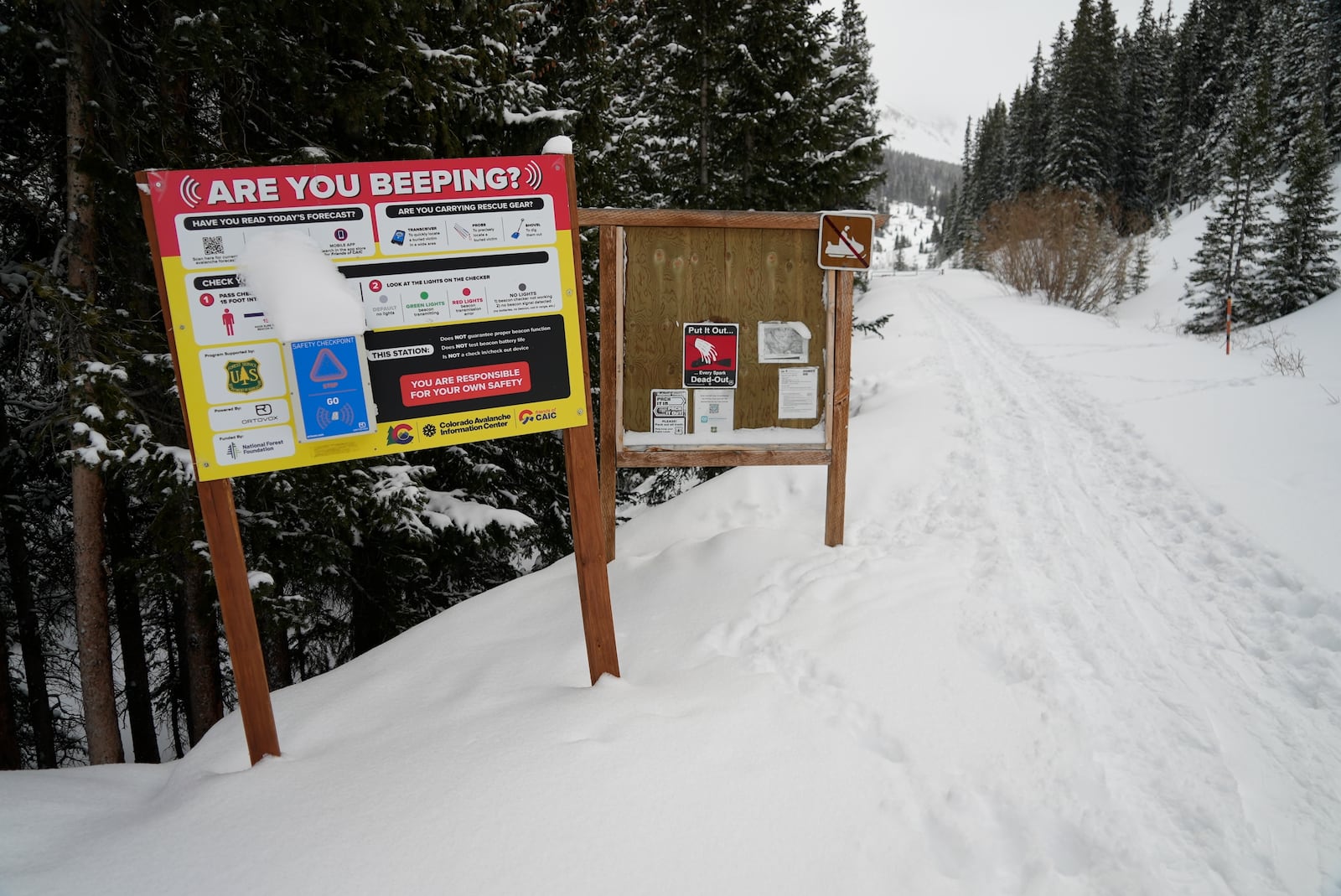 An avalanche safety sign is seen Wednesday, March 5, 2025, in Frisco, Colo. (AP Photo/Brittany Peterson)