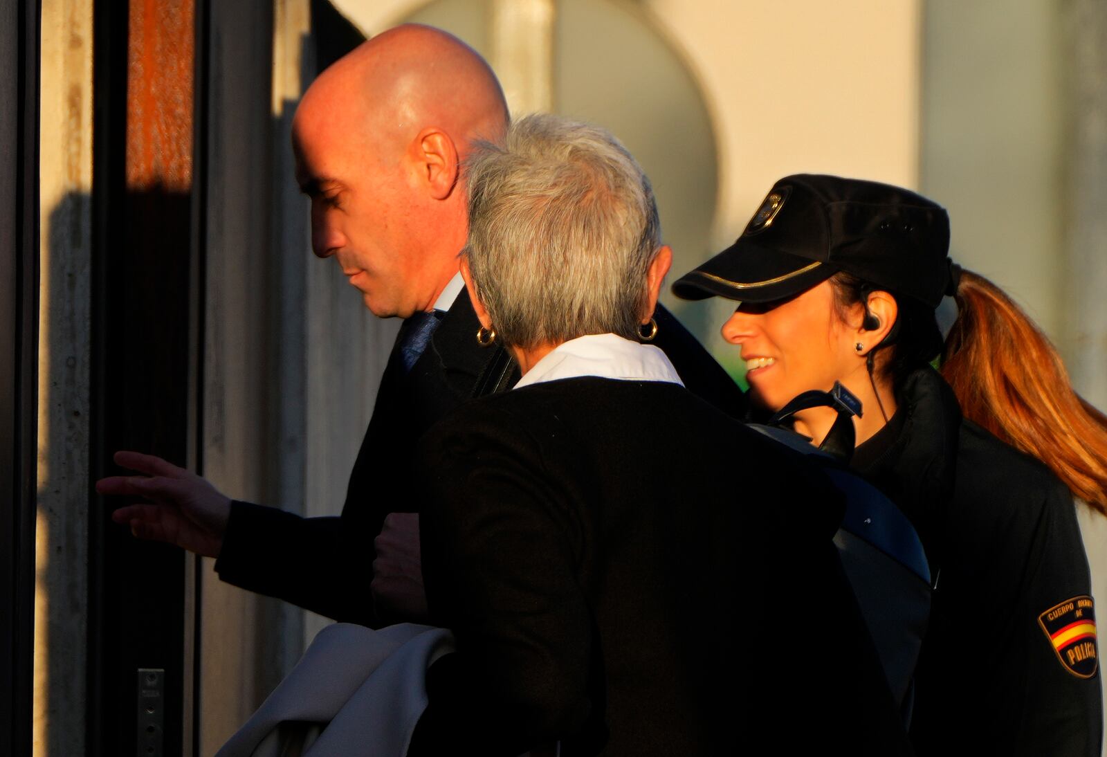 The former president of Spain's soccer federation Luis Rubiales, left, enters a court on the outskirts of Madrid, Spain, Monday Feb. 3, 2025 where he goes on trial for his unsolicited kiss on forward Jenni Hermoso. (AP Photo/Manu Fernandez)