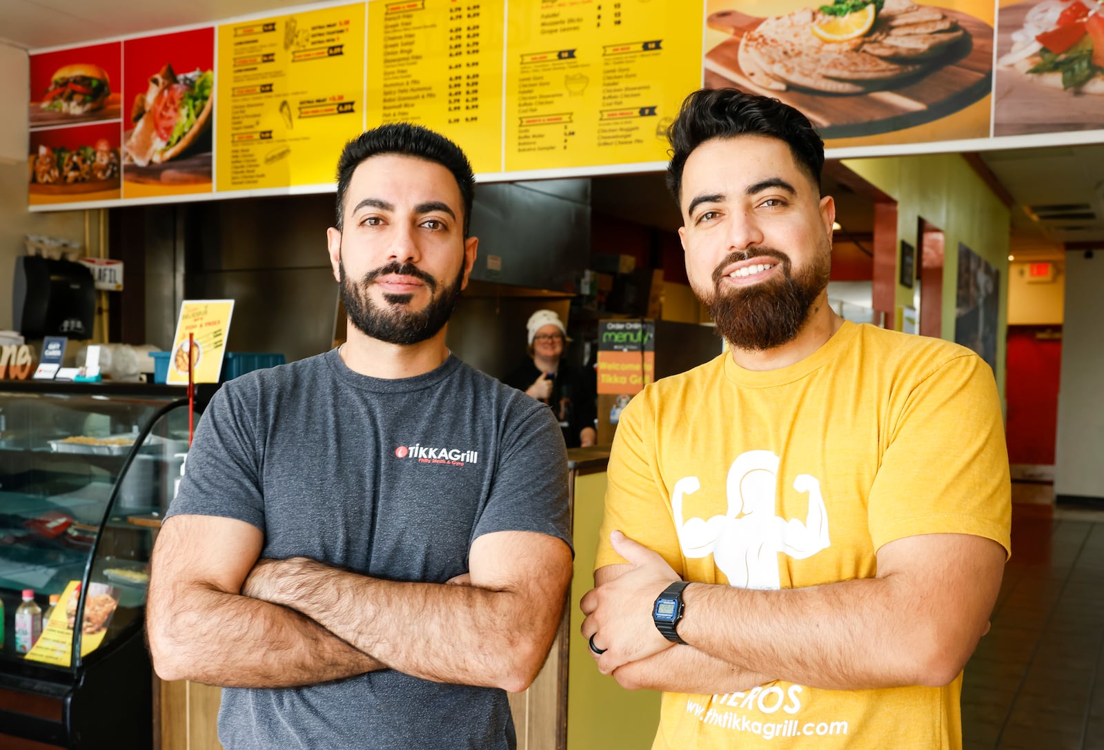 Owner Zane Hamid, right, and his brother, Hussein Amid, stand inside the Tikka Grill restaurant in West Chester Township. Tikka Grill has locations on Cincinnati Dayton Road in West Chester Township and inside Jungle Jim's Eastgate. Tikka Grill serves a variety of food items including gyros, pita wraps, subs, Greek salads, shawarma, wings and more.