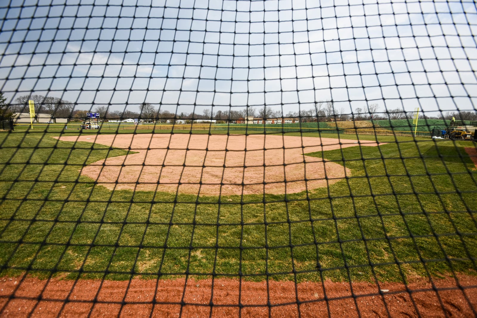 Crews worked to put finishing touches for the new Middletown City Schools baseball and softball fields in Middletown last week. NICK GRAHAM/STAFF