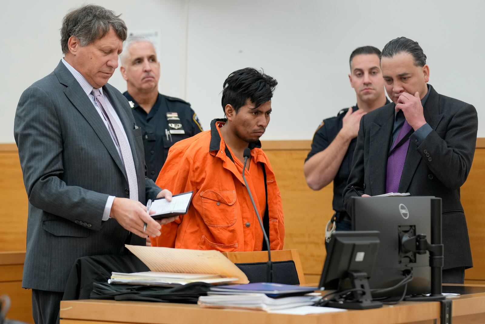 Sebastian Zapeta, center, accused of burning a woman to death inside a New York City subway train, appears in Kings County Supreme Court for an arraignment, Tuesday, Jan. 7, 2025, in New York. (AP Photo/Seth Wenig)