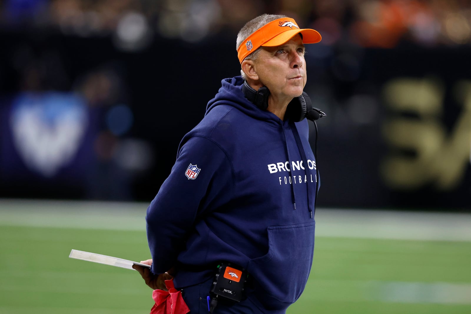 Denver Broncos head coach Sean Payton watches from the sideline during the second half of an NFL football game against the New Orleans Saints, Thursday, Oct. 17, 2024, in New Orleans. (AP Photo/Butch Dill)