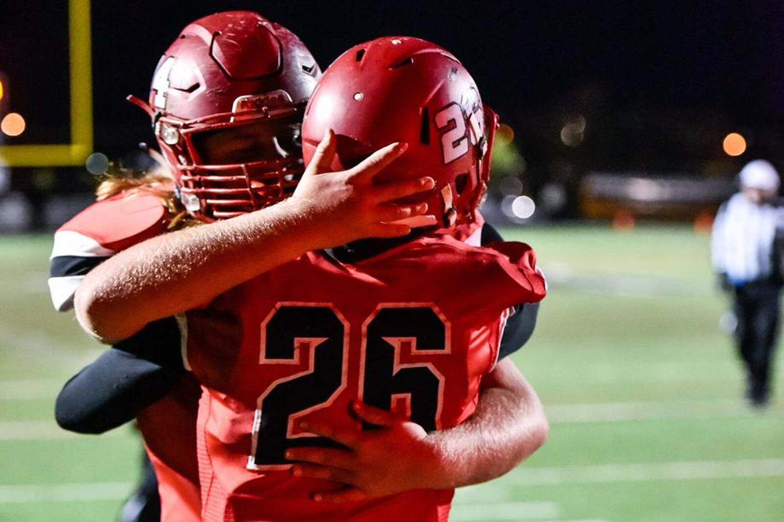 Madison’s Caleb Bolen congratulates teammate Cameron Svarda (26) after a touchdown Nov. 10 during a Division V, Region 20 semifinal against Cincinnati Hills Christian Academy at Lakota East. NICK GRAHAM/STAFF