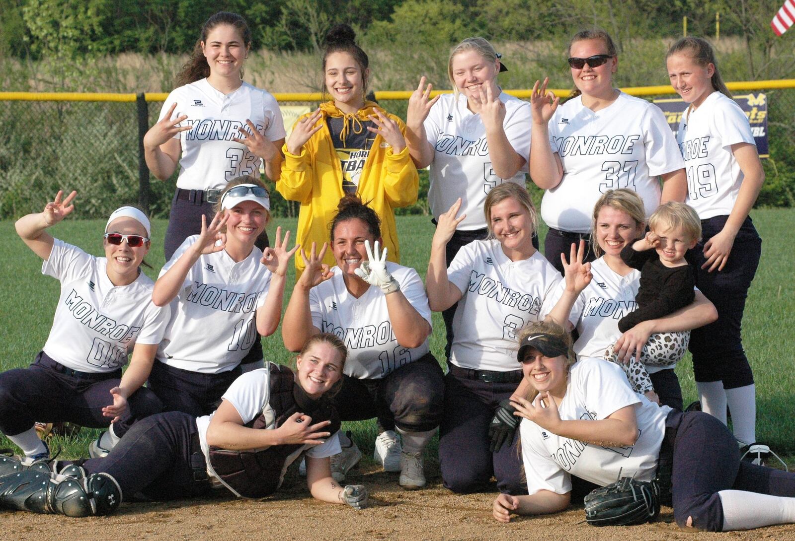 Monroe’s players celebrate their third straight Southwestern Buckeye League Southwestern Division softball championship Tuesday after defeating visiting Brookville 1-0. RICK CASSANO/STAFF