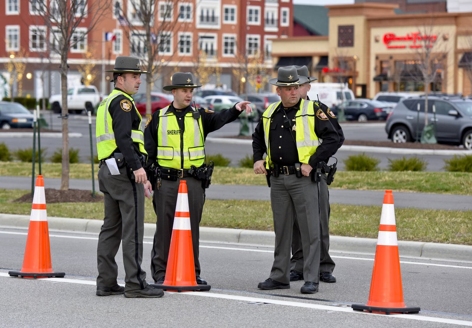 Butler County Sheriff’s deputies place cones along the turn lanes at the entrances to Liberty Center in preparation for shopping traffic on Black Friday last year. Liberty Center had paid the salary of a Butler County Deputy to patrol the $350 million development since opening one year ago, but the contract expires at the end of this month.