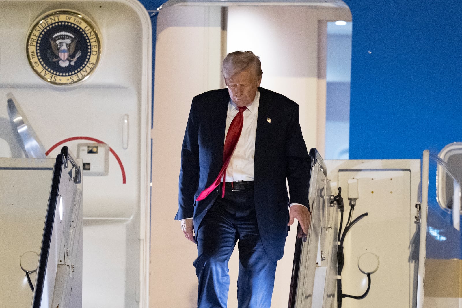 President Donald Trump arrives on Air Force One at Palm Beach International Airport, Friday, March 14, 2025, in West Palm Beach, Fla. (AP Photo/Manuel Balce Ceneta)