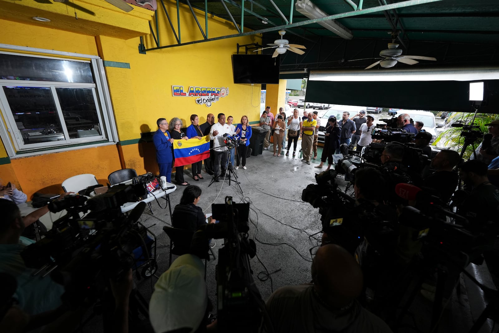 Venezuelan community leaders speak during a press conference to denounce changes to the protections that shielded hundreds of thousands of Venezuelans from deportation, Monday, Feb. 3, 2025, in Doral, Fla. (AP Photo/Rebecca Blackwell)