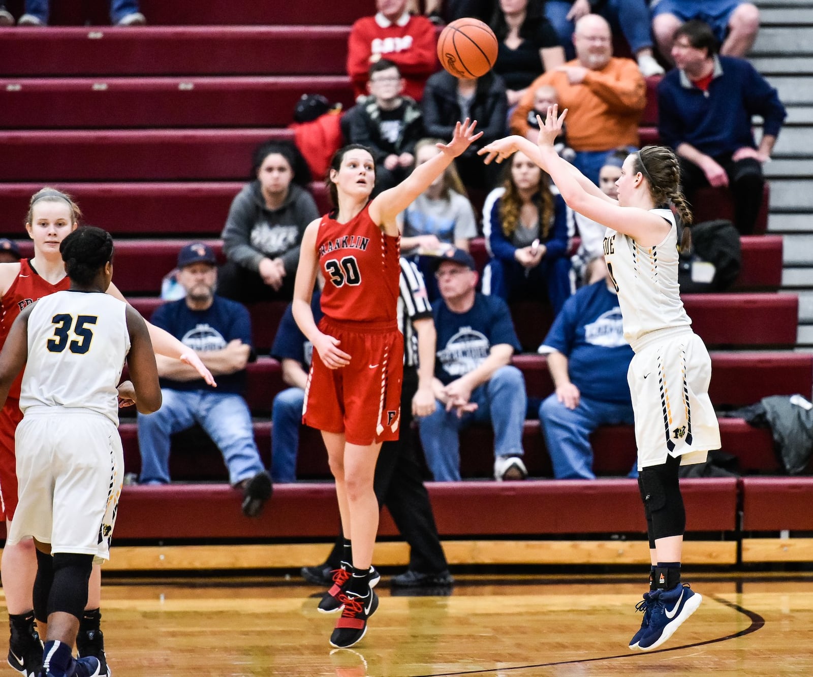 Franklin’s Layne Ferrell tries to block a shot by Monroe’s Sophie Sloneker during their Division II sectional final Feb. 26, 2018, at Lebanon. Franklin won 44-39. NICK GRAHAM/STAFF