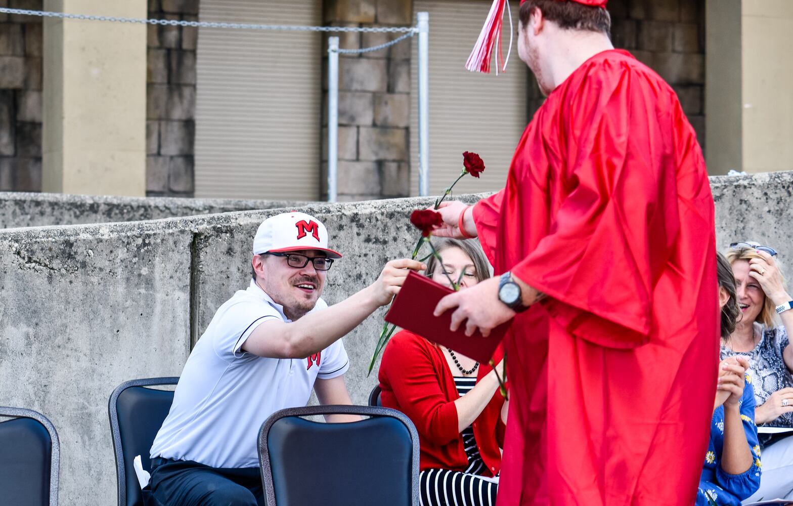 Madison High School drive-thru graduation ceremony at Land of Illusion