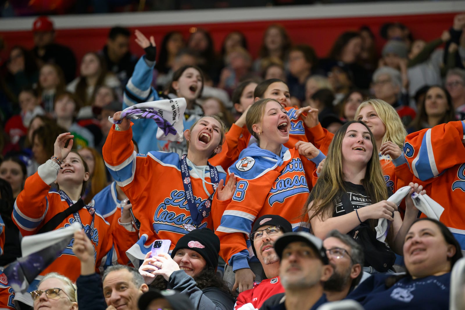 Fans reacts during the second period of a PWHL game between the New York Sirens and the Minnesota Frost, at Little Caesars Arena, in Detroit, Sunday, March 16, 2025. (David Guralnick/Detroit News via AP)