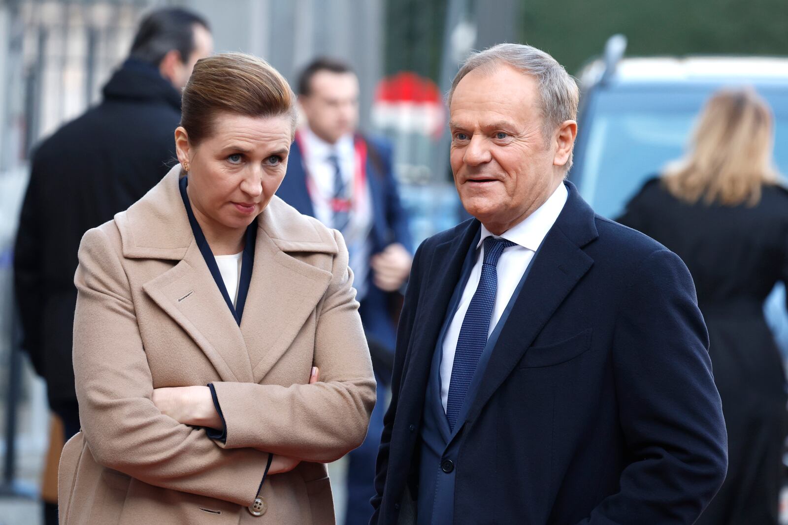 Denmark's Prime Minister Mette Frederiksen, left, speaks with Poland's Prime Minister Donald Tusk as they arrive for an EU summit at the Egmont Palace in Brussels, Monday, Feb. 3, 2025. (AP Photo/Geert Vanden Wijngaert)