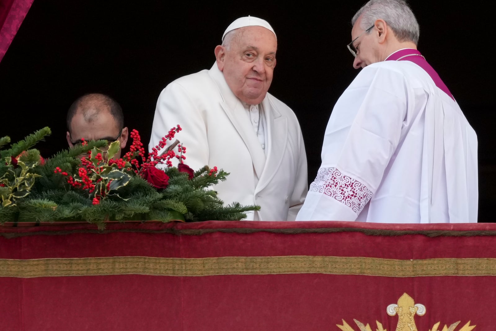 Pope Francis looks on after delivering the Urbi et Orbi (Latin for 'to the city and to the world' ) Christmas' day blessing from the main balcony of St. Peter's Basilica at the Vatican, Wednesday, Dec. 25, 2024. (AP Photo/Andrew Medichini)