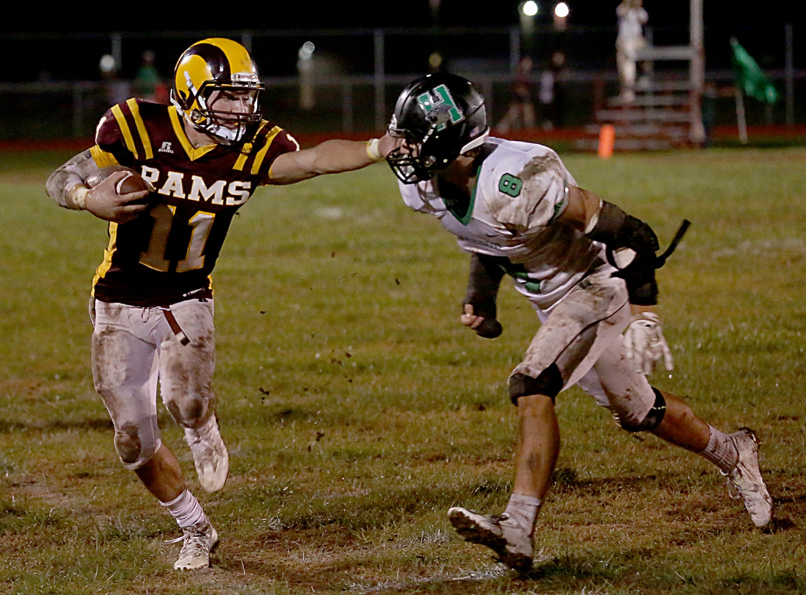 Ross quarterback Zach Arno tries to avoid Harrison defensive back Bailey Smith during their game at Ross on Sept. 16. CONTRIBUTED PHOTO BY E.L. HUBBARD