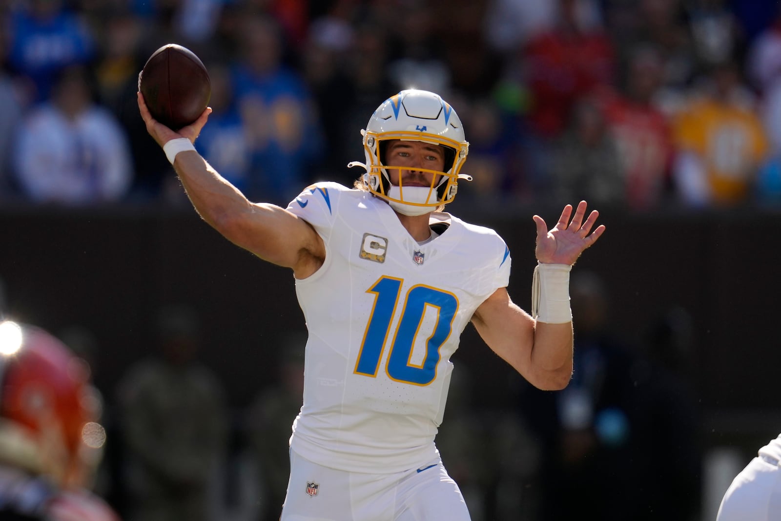 Los Angeles Chargers quarterback Justin Herbert passes against the Cleveland Browns in the first half of an NFL football game Sunday, Nov. 3, 2024, in Cleveland. (AP Photo/Sue Ogrocki)