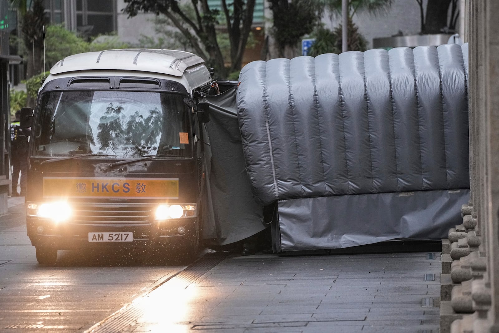 A Correctional Services prison van arrives at the Court of Final Appeal in Hong Kong, Thursday, March 6, 2025. Three former organizers of Hong Kong's annual vigil in remembrance of the 1989 Tiananmen Square crackdown won their bid at the top court on Thursday to overturn their conviction over their refusal to provide information to police, marking a rare victory for the city's pro-democracy activists. (AP Photo/Chan Long Hei)