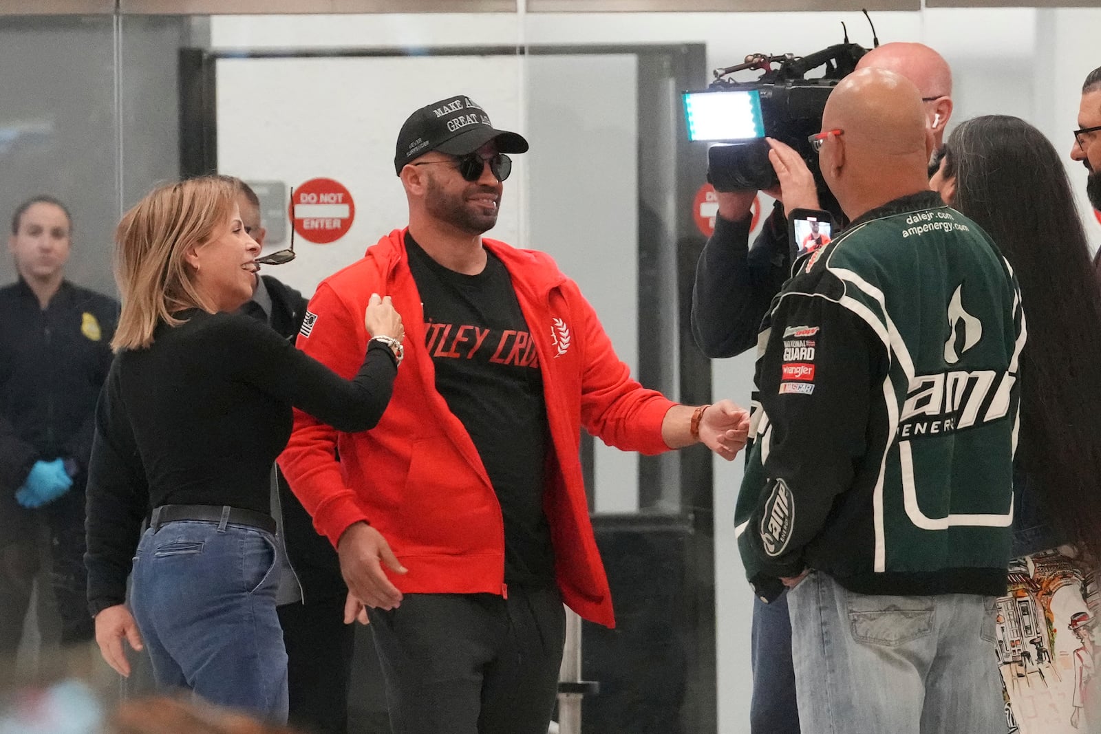 Enrique Tarrio arrives at Miami International Airport, Wednesday, Jan. 22, 2025, in Miami. Tarrio was pardoned by President Donald Trump after he was convicted of seditious conspiracy for his role in the January 6 attack on the U.S. Capitol. (AP Photo/Marta Lavandier)