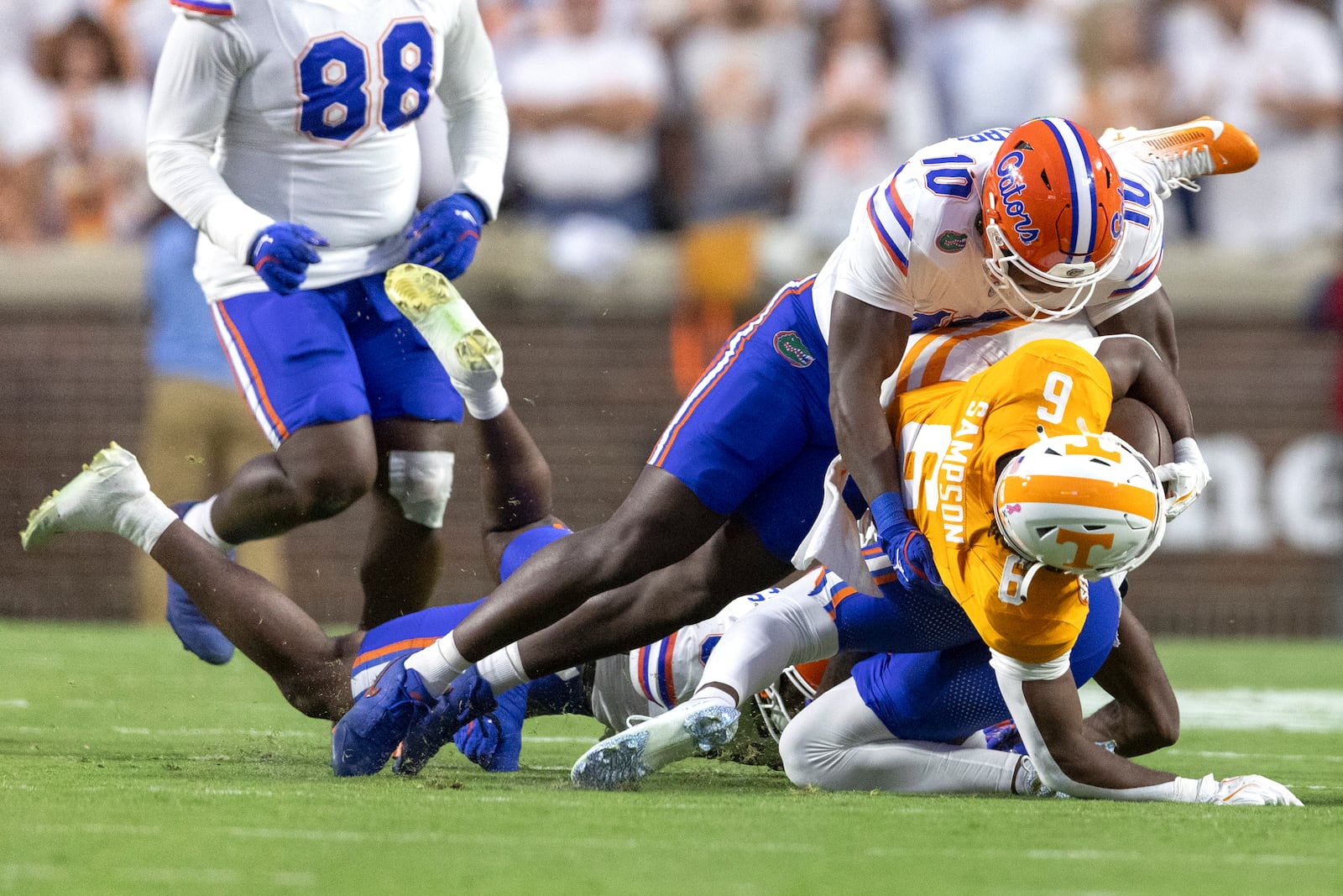 Tennessee running back Dylan Sampson (6) is tackled by Florida linebacker Grayson Howard (10) during the first half of an NCAA college football game, Saturday, Oct. 12, 2024, in Knoxville, Tenn. (AP Photo/Wade Payne)