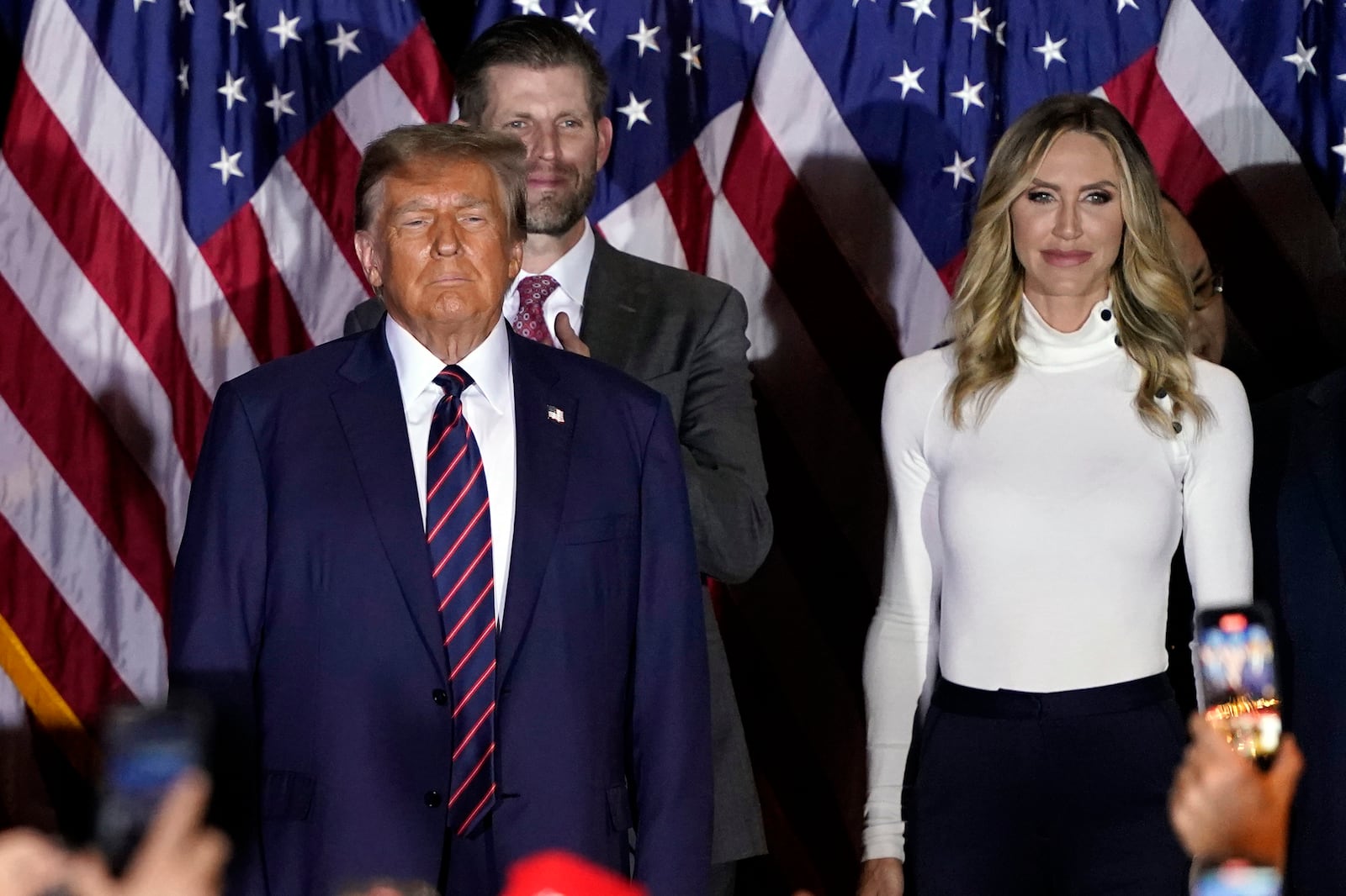 FILE - Republican presidential candidate former President Donald Trump, from left, arrives to speak at a primary election night party in Nashua, N.H., Jan. 23, 2024, with Eric Trump and Lara Trump. (AP Photo/Pablo Martinez Monsivais, File)