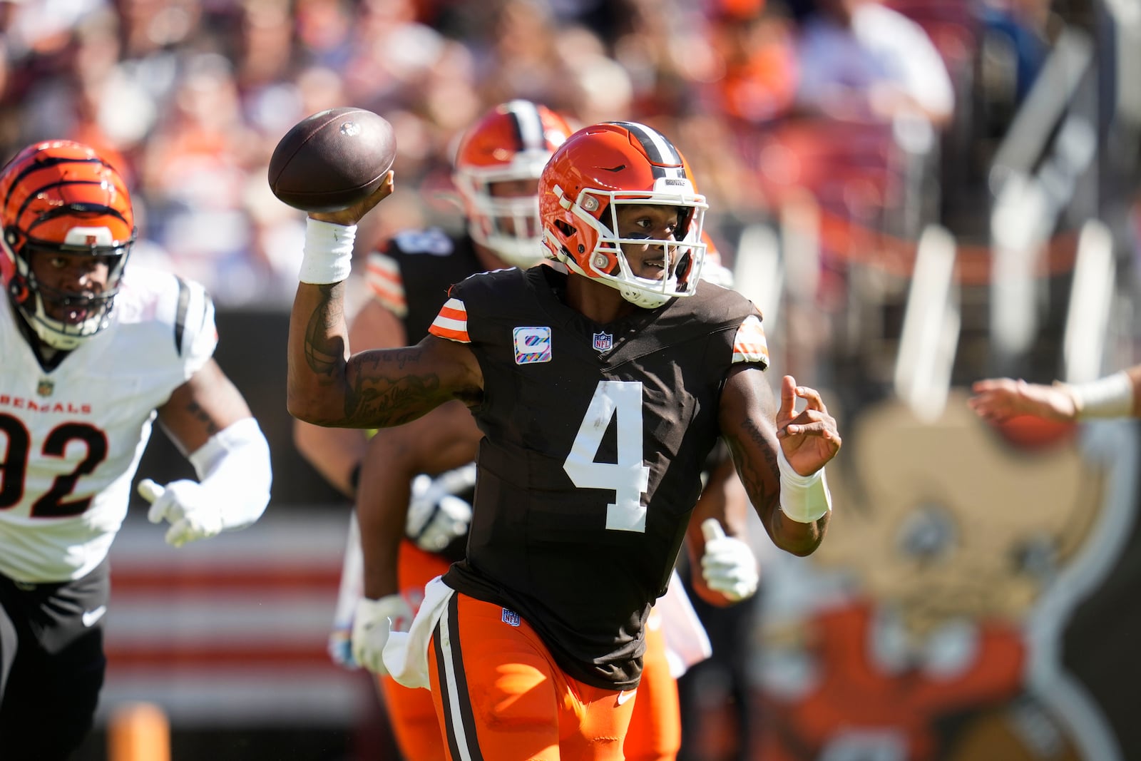 Cleveland Browns quarterback Deshaun Watson (4) looks to pass in the first half of an NFL football game against the Cincinnati Bengals, Sunday, Oct. 20, 2024, in Cleveland. (AP Photo/Sue Ogrocki)