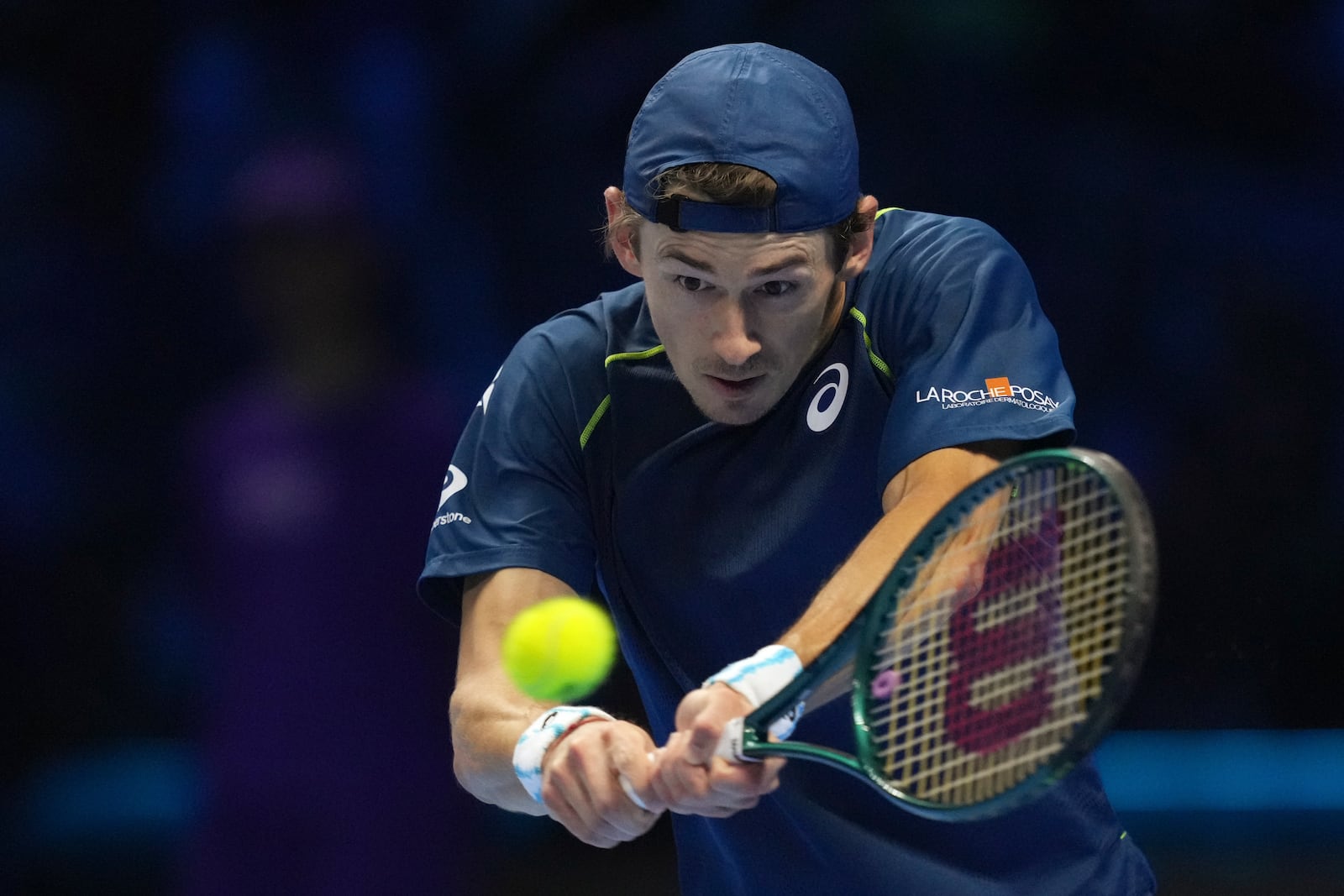 Australia's Alex de Minaur returns the ball to United States' Taylor Fritz during their singles tennis match of the ATP World Tour Finals at the Inalpi Arena, in Turin, Italy, Thursday, Nov. 14, 2024. (AP Photo/Antonio Calanni)