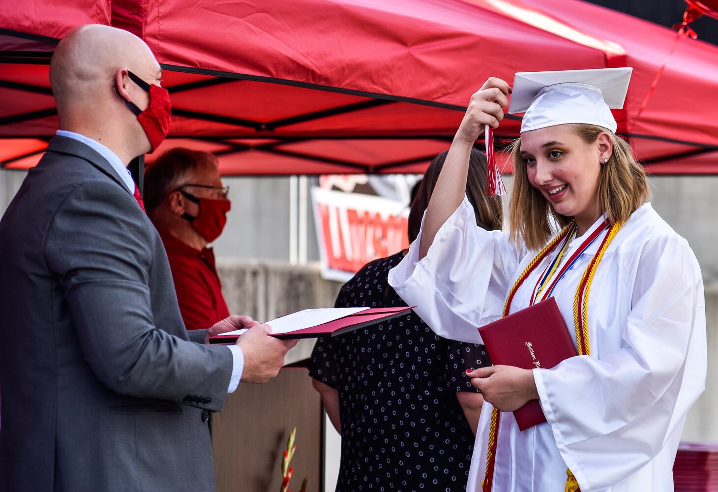 Madison High School drive-thru graduation ceremony at Land of Illusion