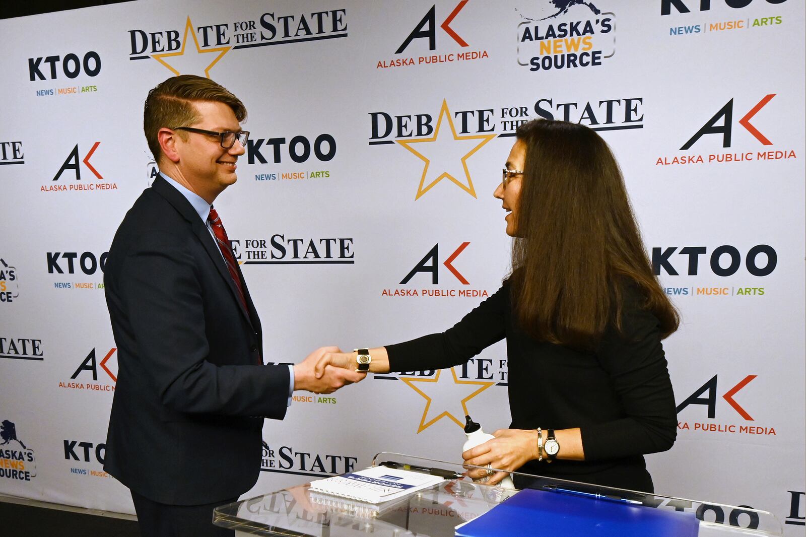 Republican U.S. House candidate Nick Begich and incumbent Democratic Rep. Mary Peltola shake hands after a debate at Alaska Public Media on Thursday evening, Oct. 10, 2024. (Bill Roth/Anchorage Daily News via AP)