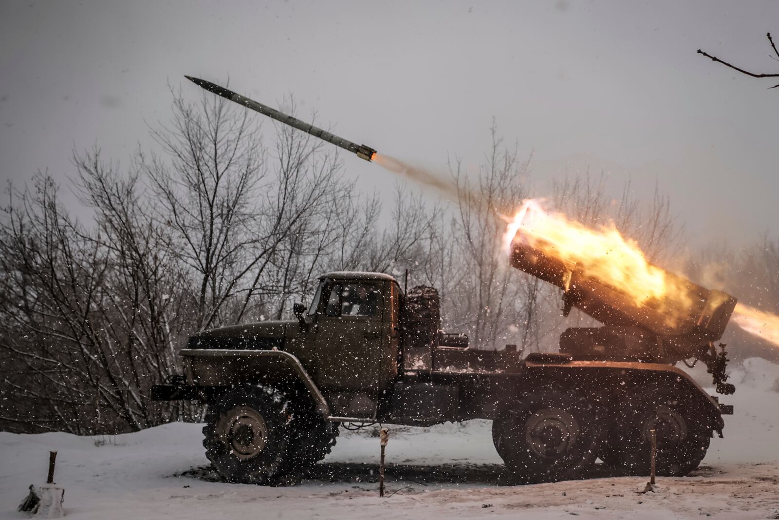 In this photo provided by Ukraine's 24th Mechanised Brigade press service, Ukrainian servicemen fire an MRLS BM-21 'Grad' towards Russian army positions near Chasiv Yar, Donetsk region, Ukraine, Saturday, Feb. 15, 2025. (Oleg Petrasiuk/Ukraine's 24th Mechanised Brigade via AP)