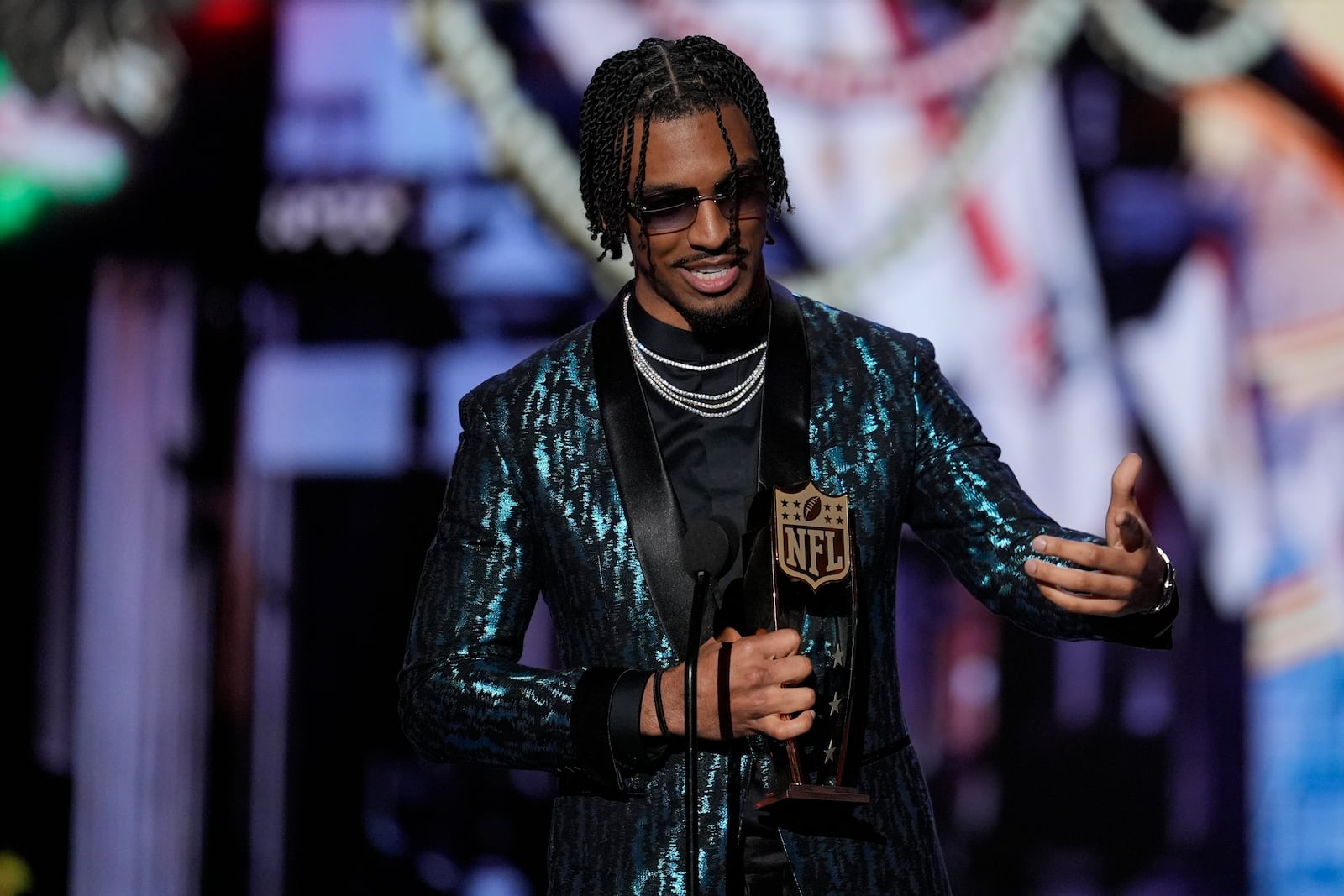 Washington Commanders' Jayden Daniels, AP Offensive rookie of the year speaks during the NFL Honors award show ahead of the Super Bowl 59 football game, Thursday, Feb. 6, 2025, in New Orleans. (AP Photo/David J. Phillip)