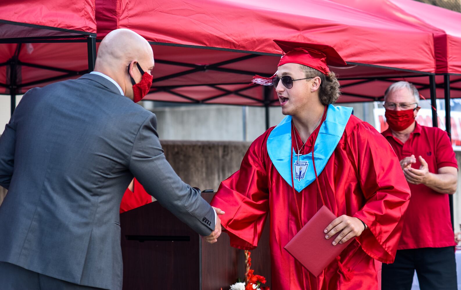 Madison High School drive-thru graduation ceremony at Land of Illusion