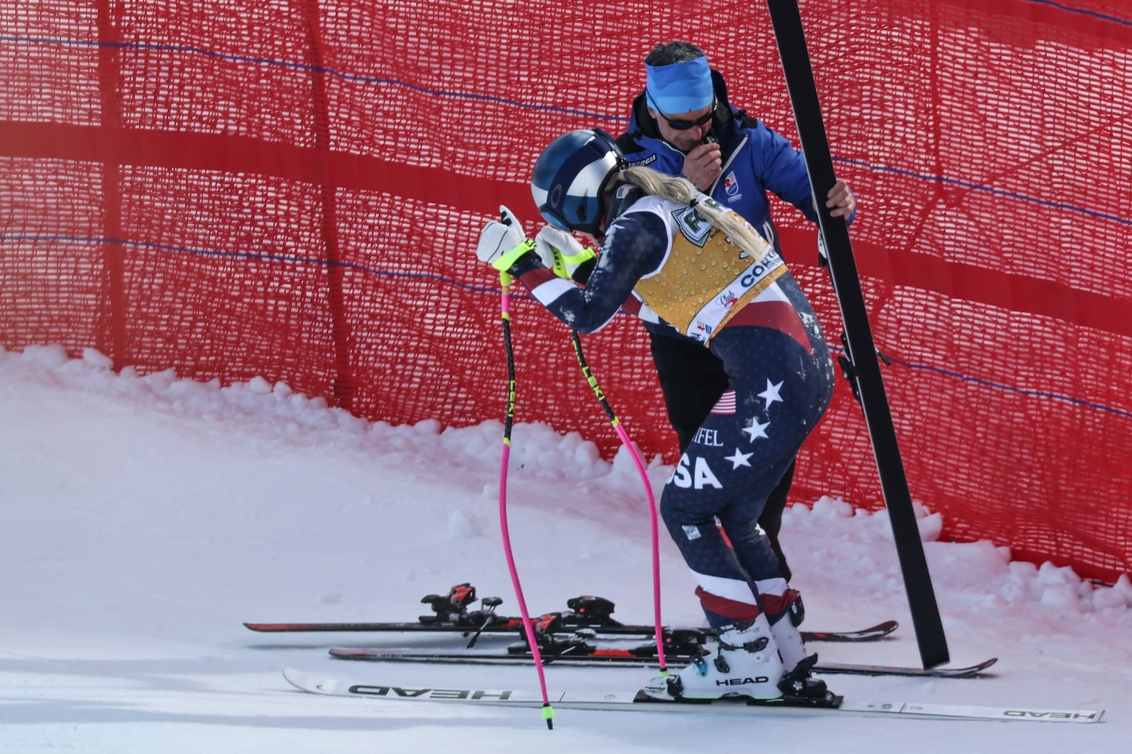 United States' Lindsey Vonn stands up after crashing during an alpine ski, women's World Cup downhill training, in Cortina d'Ampezzo, Italy, Thursday, Jan. 16, 2025. (AP Photo/Marco Trovati)