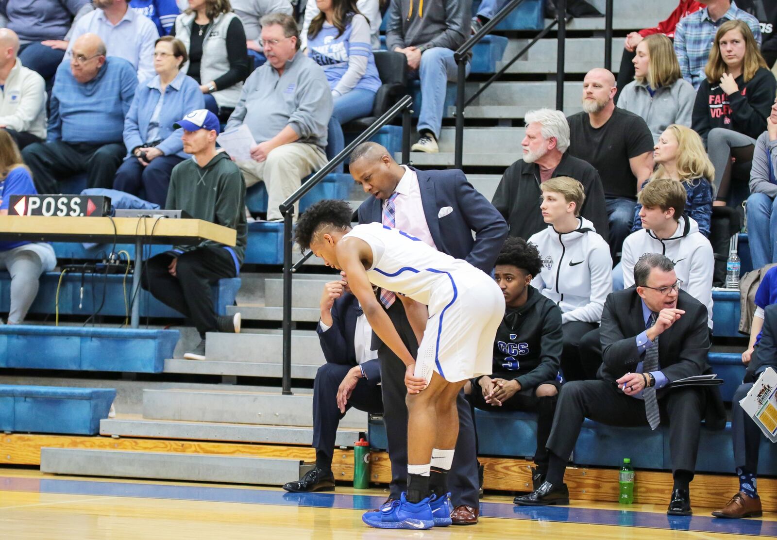 Cincinnati Christian coach Carl Woods talks to Miguel Ringer (2) during Friday night’s game against Seven Hills in Fairfield Township. The visiting Stingers won 45-40. PHOTO BY KRAE/WWW.KRAEPHOTOGRAPHY.COM