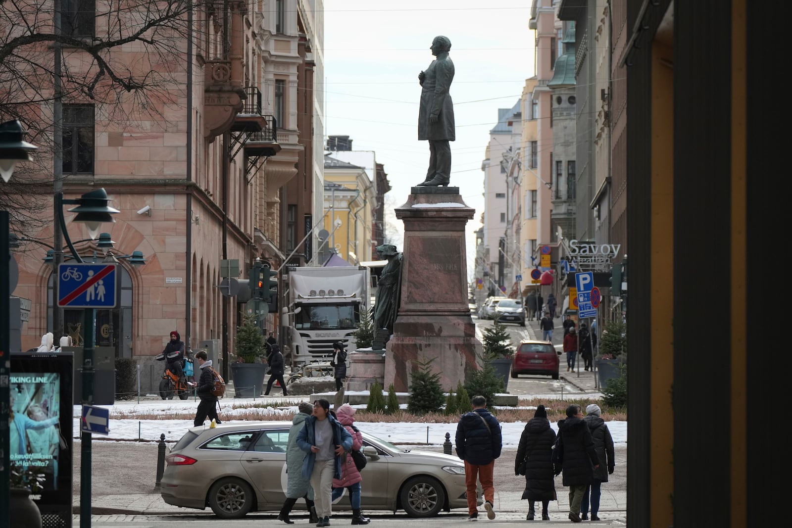 People walk past a monument to poet and writer Johan Ludvig Runeberg in Helsinki, Finland, Saturday, March 15, 2025. (AP Photo/Sergei Grits)