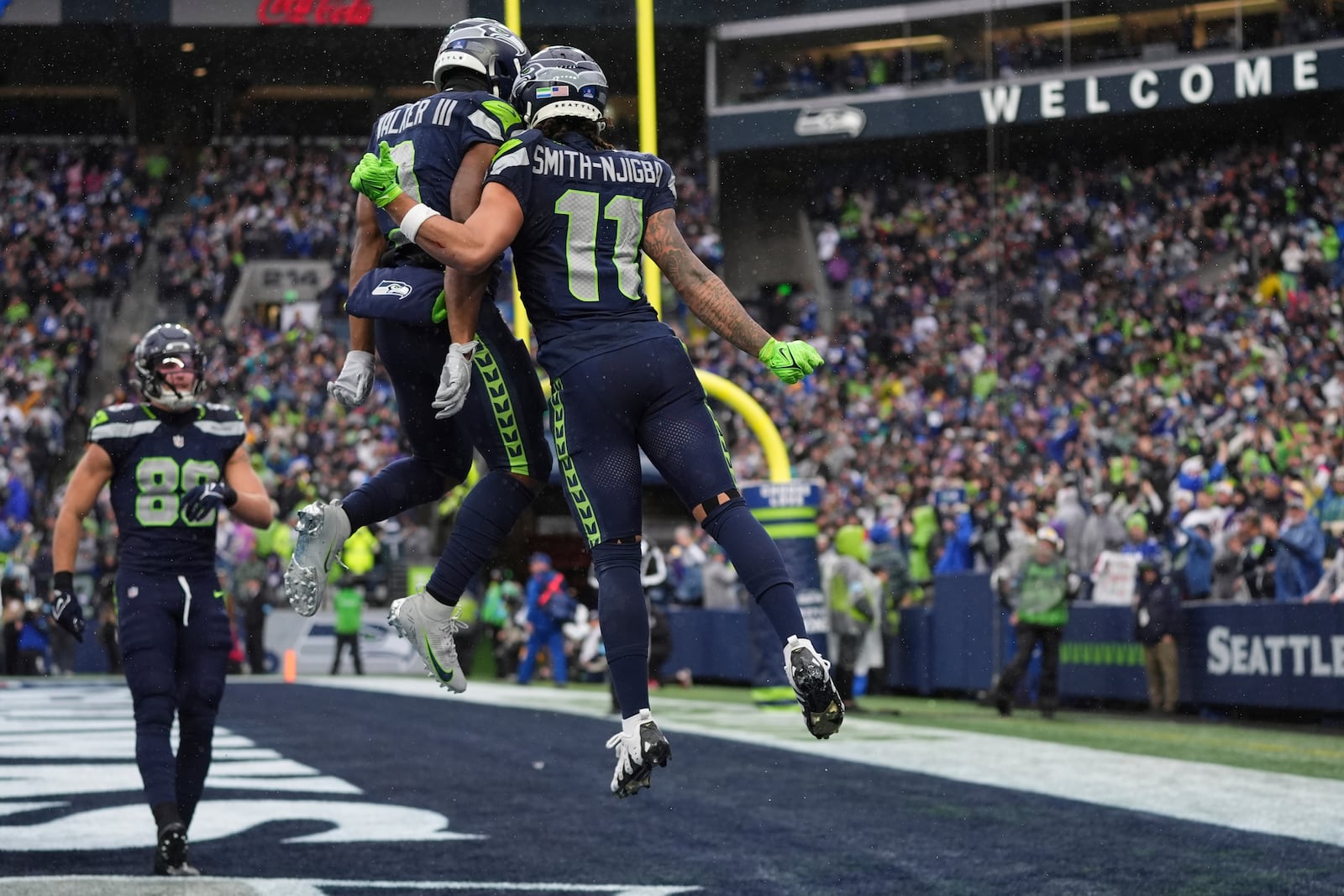 Seattle Seahawks wide receiver Jaxon Smith-Njigba (11) celebrates after scoring an 18-yard touchdown during the first half of an NFL football game against the Minnesota Vikings, Sunday, Dec. 22, 2024, in Seattle. (AP Photo/Lindsey Wasson)