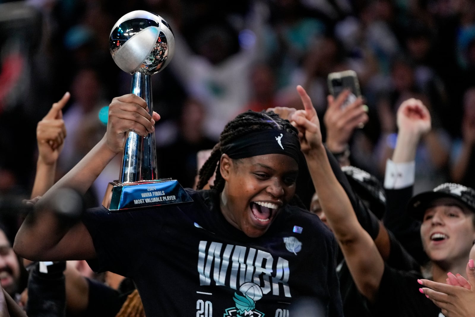 New York Liberty forward Jonquel Jones (35) reacts after being given the MVP Award after winning the championship against the Minnesota Lynx in Game 5 of the WNBA basketball final series, Sunday, Oct. 20, 2024, in New York. (AP Photo/Pamela Smith)