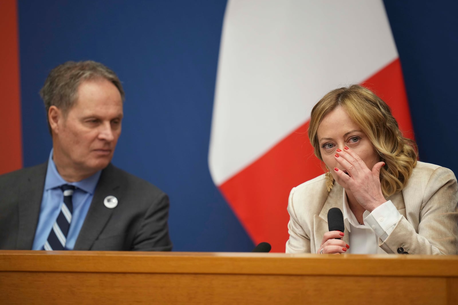 Italian Premier Giorgia Meloni holds the 2024 year-end press conference, flanked by the Italian president of the Order of Journalists, Carlo Bartoli, in Rome, Thursday, Jan. 9, 2025. (AP Photo/Alessandra Tarantino)