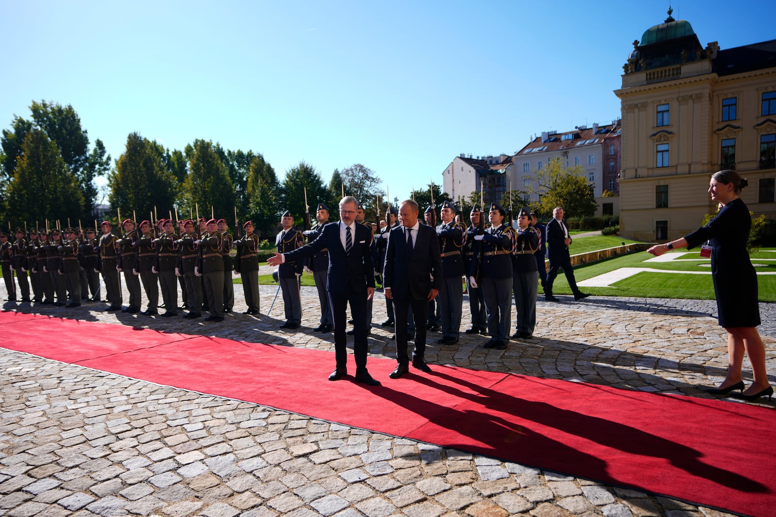 Czech Republic's Prime Minister Petr Fiala, left, welcomes his Poland's counterpart Donald Tusk as they meet in Prague, Czech Republic, Wednesday, Oct. 9, 2024. (AP Photo/Petr David Josek)