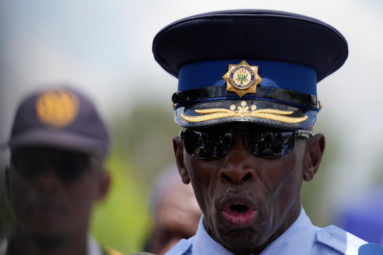 The Acting Provincial Commissioner of North West, Major General Patrick Asaneng, speaks to journalists outside an abandoned gold mine, where miners were rescued from below ground, in Stilfontein, South Africa, Thursday, Jan. 16, 2025. (AP Photo/Themba Hadebe)