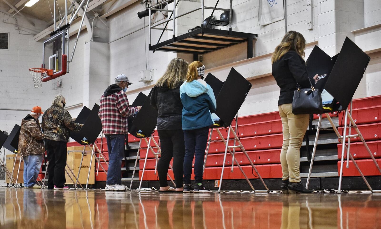 Voters cast their ballot on election day at Madison schools auxiliary gymnasium Tuesday, Nov. 3, 2020 in Madison Township. NICK GRAHAM / STAFF