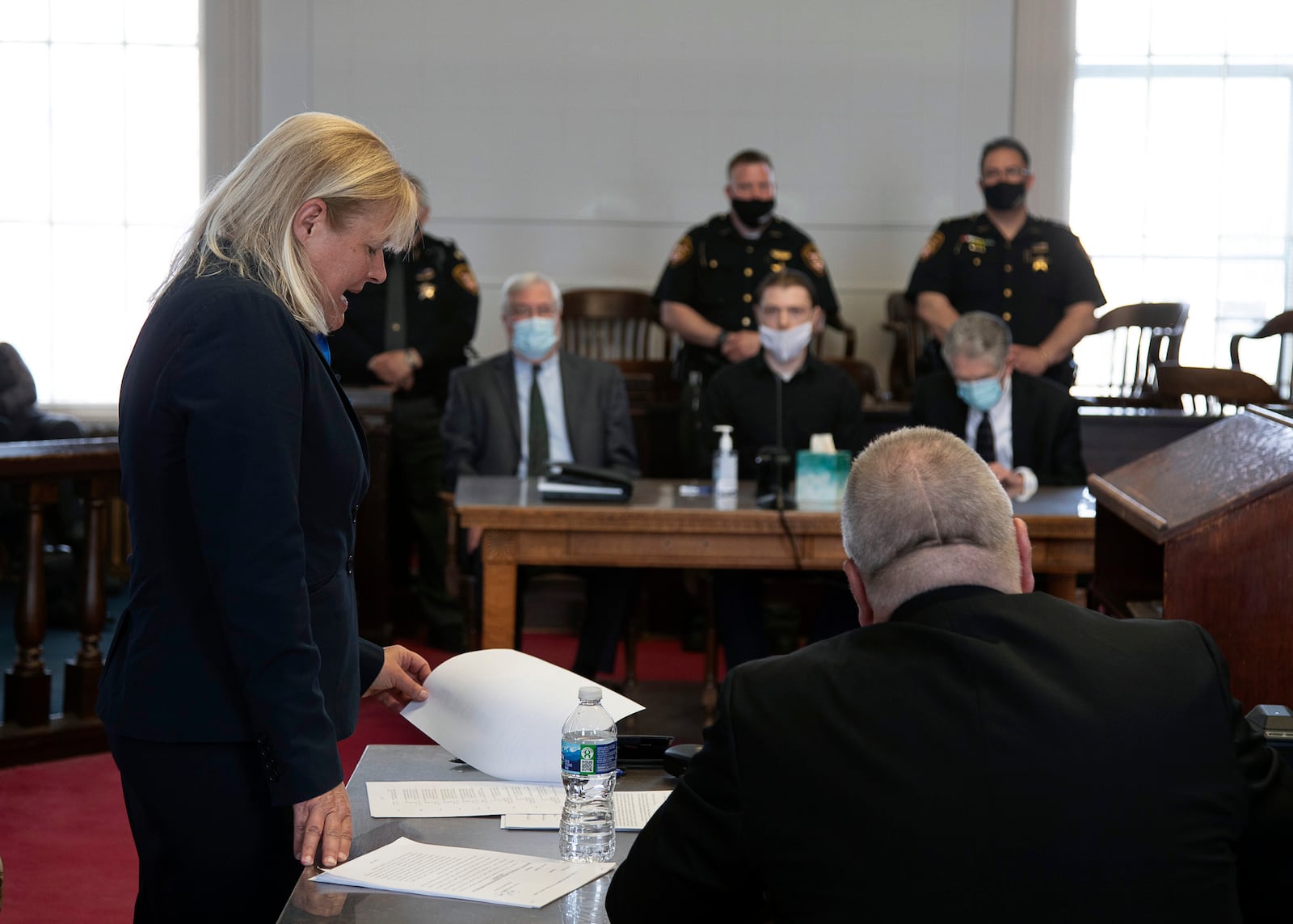 Special Prosecutor Angela Canepa reads over the paperwork signed by Edward "Jake" Wagner during his plea hearing at the Pike County Courthouse, Thursday, April 22, 2021 in Pike County, Ohio. Edward "Jake" Wagner pleaded guilty Thursday in the murders of his child’s mother and seven members of her family in 2016 — a grisly crime that spread terror across their rural Ohio community and stirred rumors of drug dealers and hit men before authorities concluded it stemmed from a custody dispute. (Robert McGraw/The Chillicothe Gazette via AP)