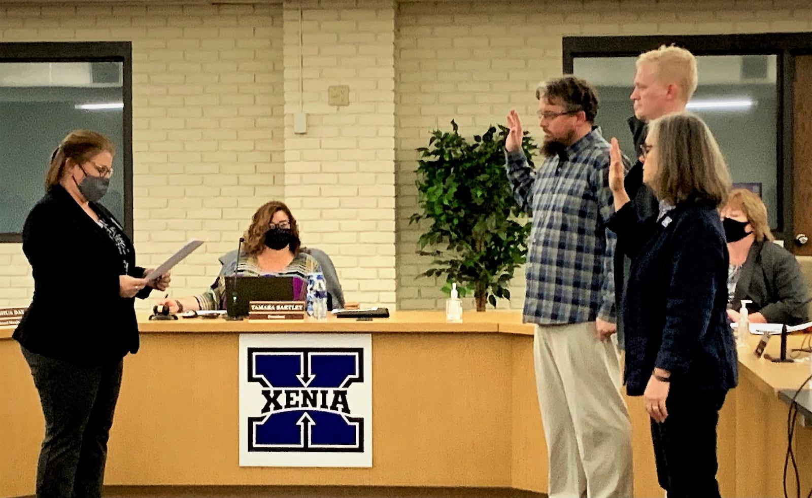 Newly elected Xenia Community Schools board members George Leightenheimer, Josh Day, and Mary Grech are sworn in on Monday.